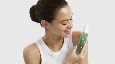 Woman holding Pai Skincare Phaze PHA Clarifying Face Wash