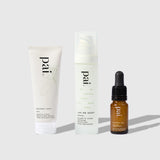 Three Pai Skincare products arranged on white surface: Middlemist Seven cleanser tube, Love and Haight moisturizer pump bottle, and Hyaluronic Acid serum dropper bottle